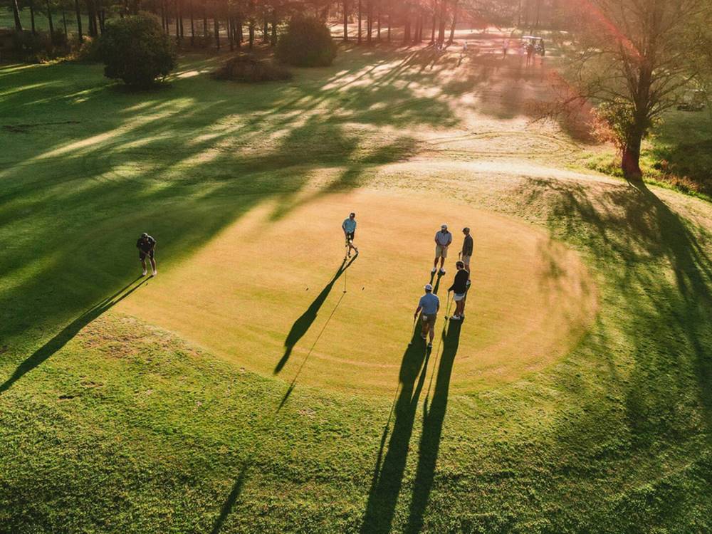 An aerial view of men playing golf