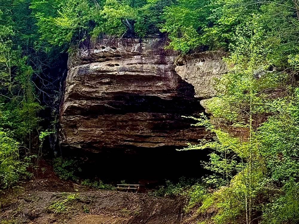 A picnic table near a scenic rock formation