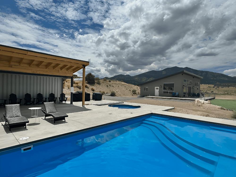 Lounge chairs by the pool at Sandy Beach at Yuba Lake