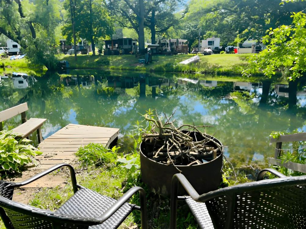 Fire pit with water view at Golden Acres Park