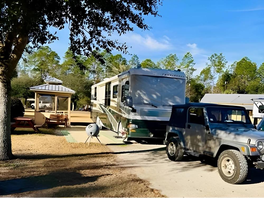 Parked RV at site Suwannee River Rendezvous Resort & Campground