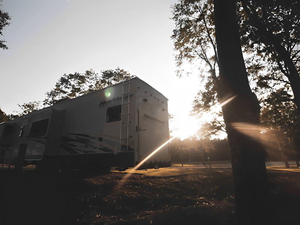 Sun setting behind an RV at Fireside RV Park