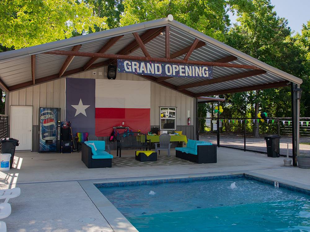 A covered seating area near the pool