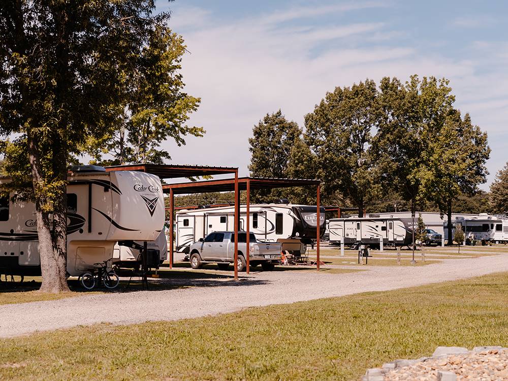 A row of RVs parked in their sites