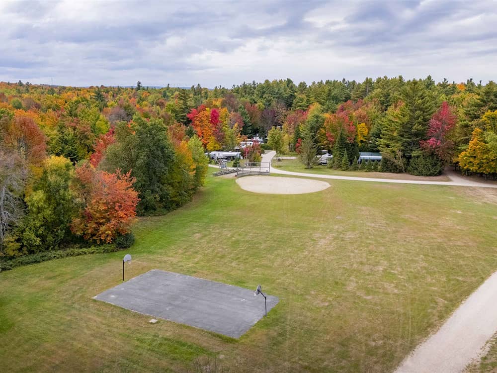 Aerial view of a basketball court and ball field