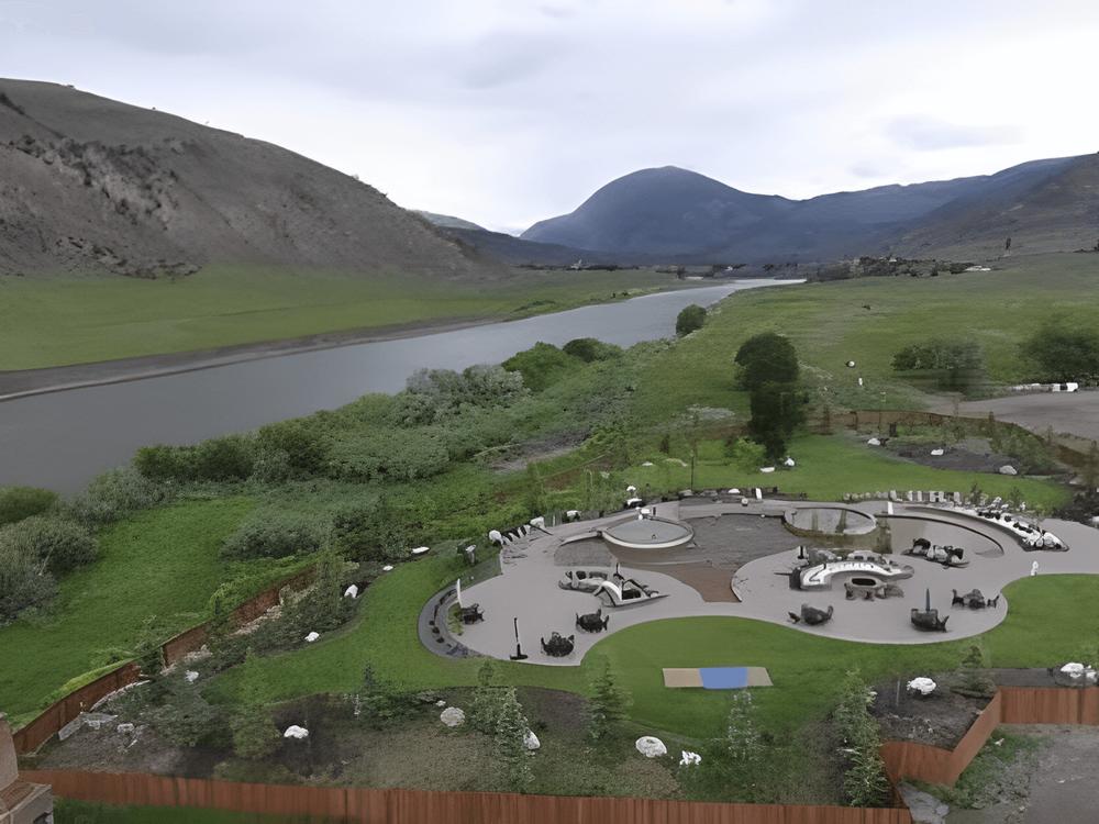 Aerial view of the park and river at Yellowstone Hot Springs Resort