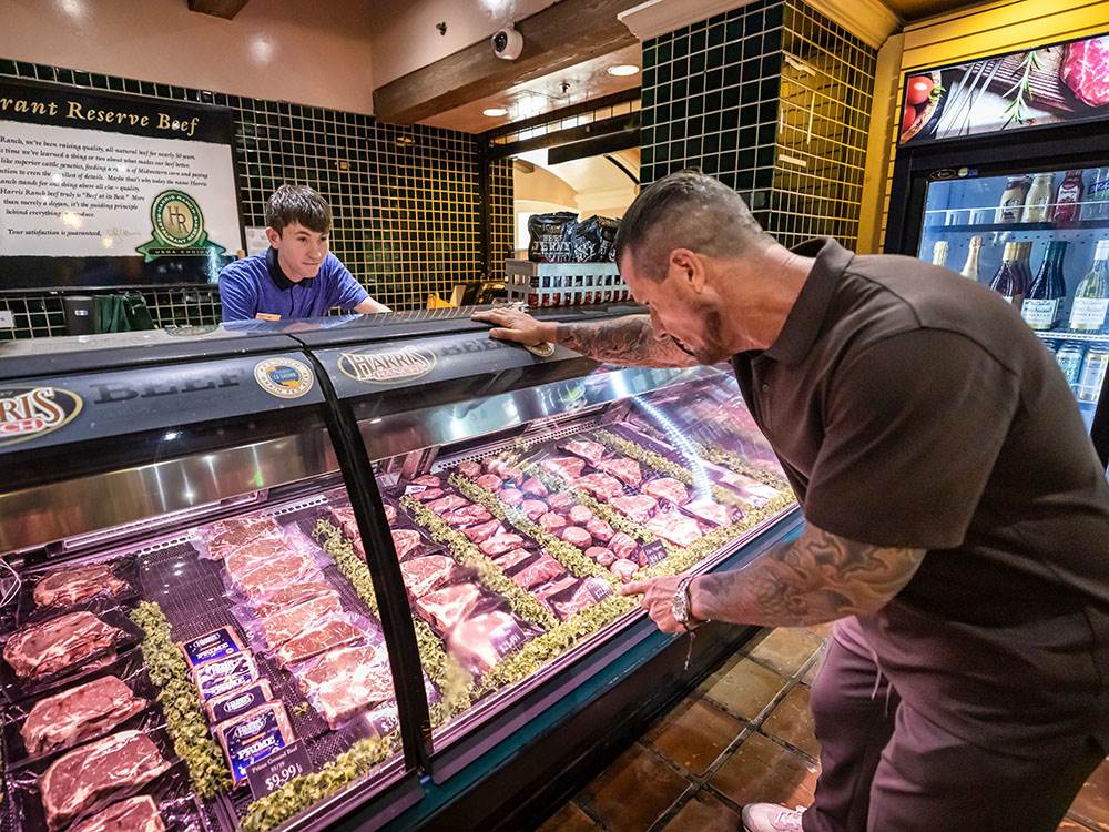 A man at the meat counter