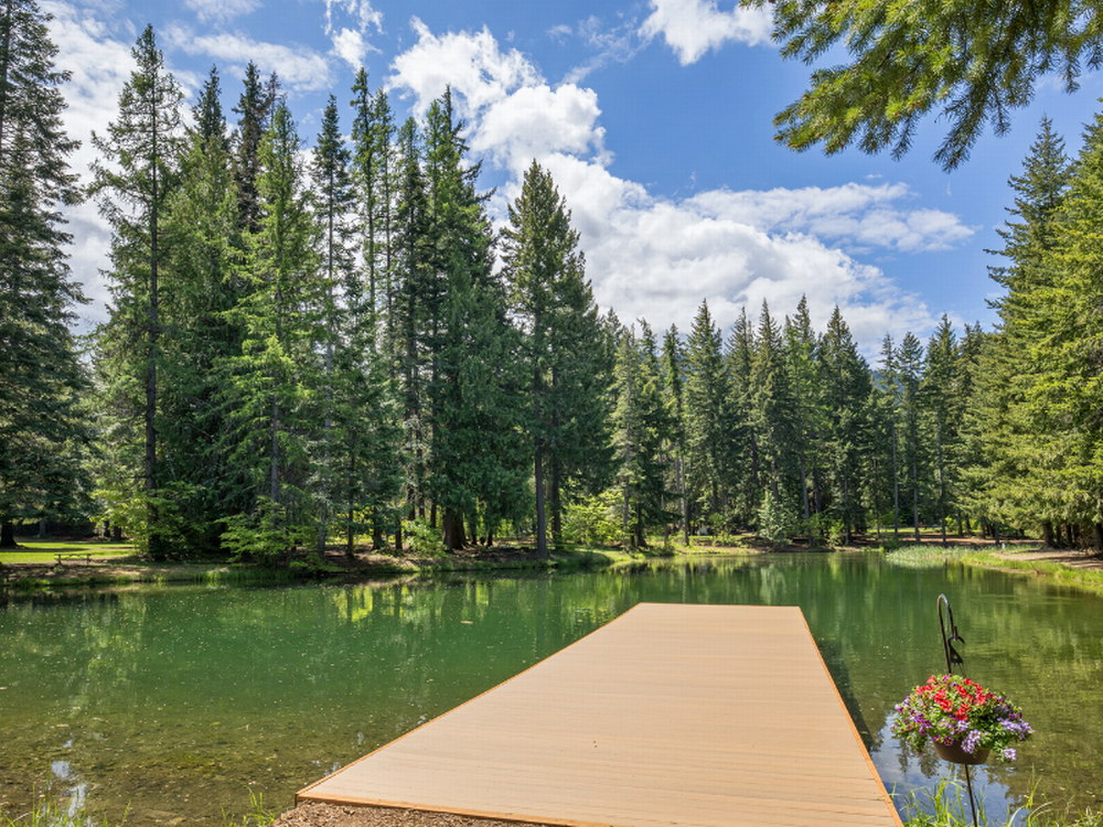 A view of the lake and trees at Lake Sena Campground at Circle 8 Ranch