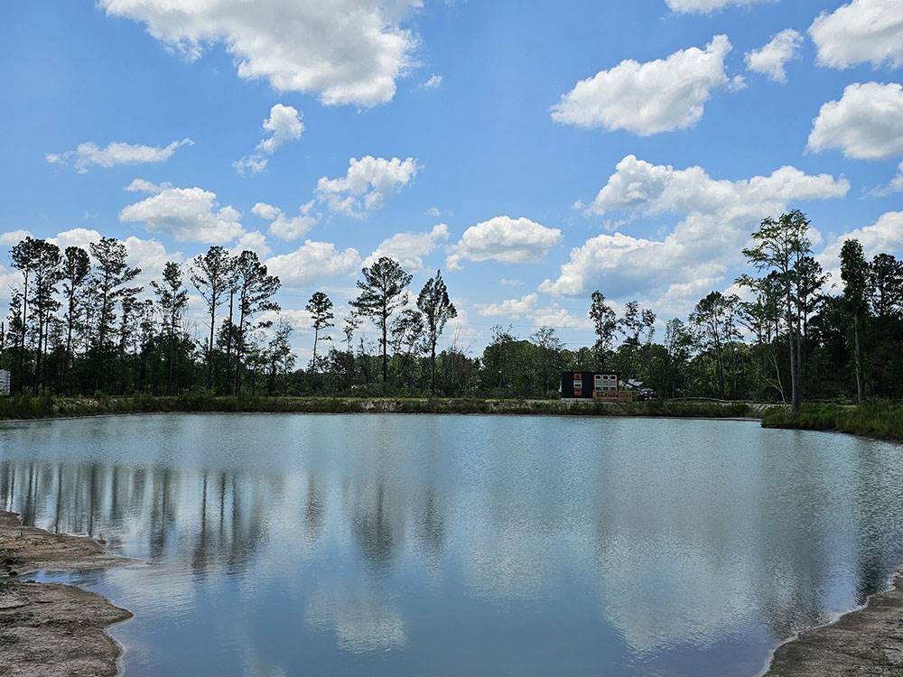 Blue sky and clouds reflecting on the pond