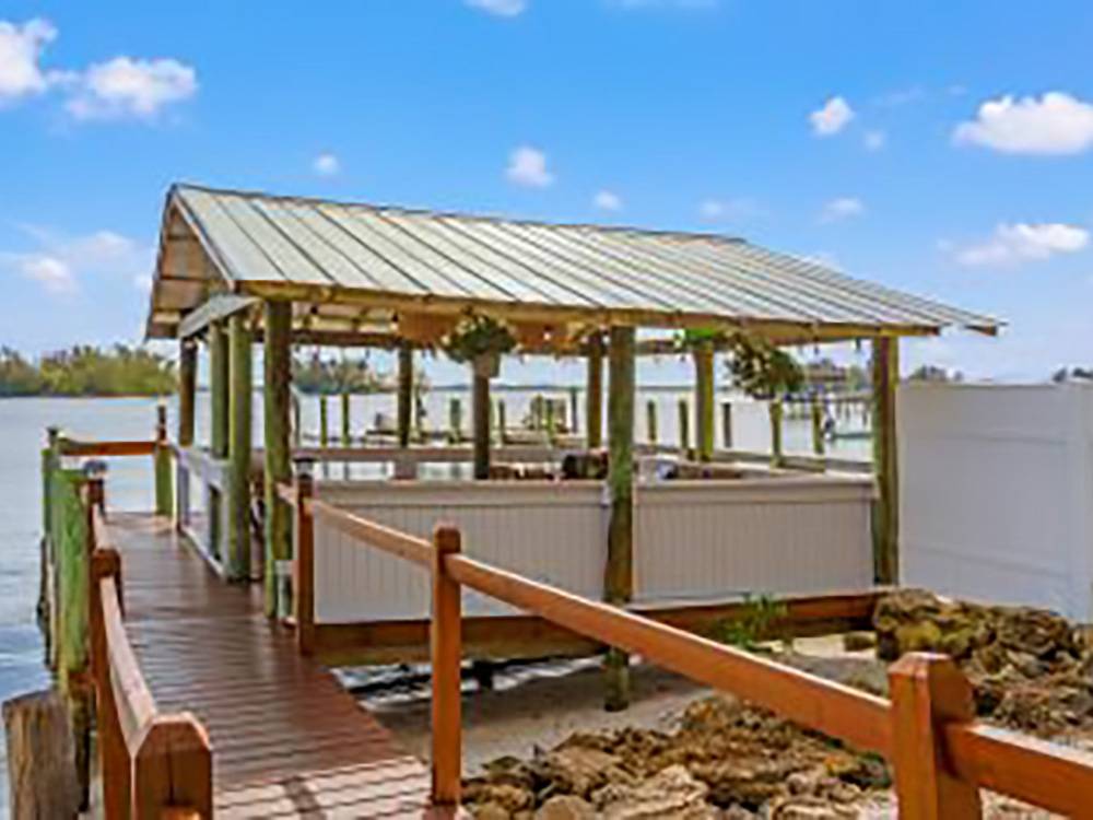 A covered seating area on the river
