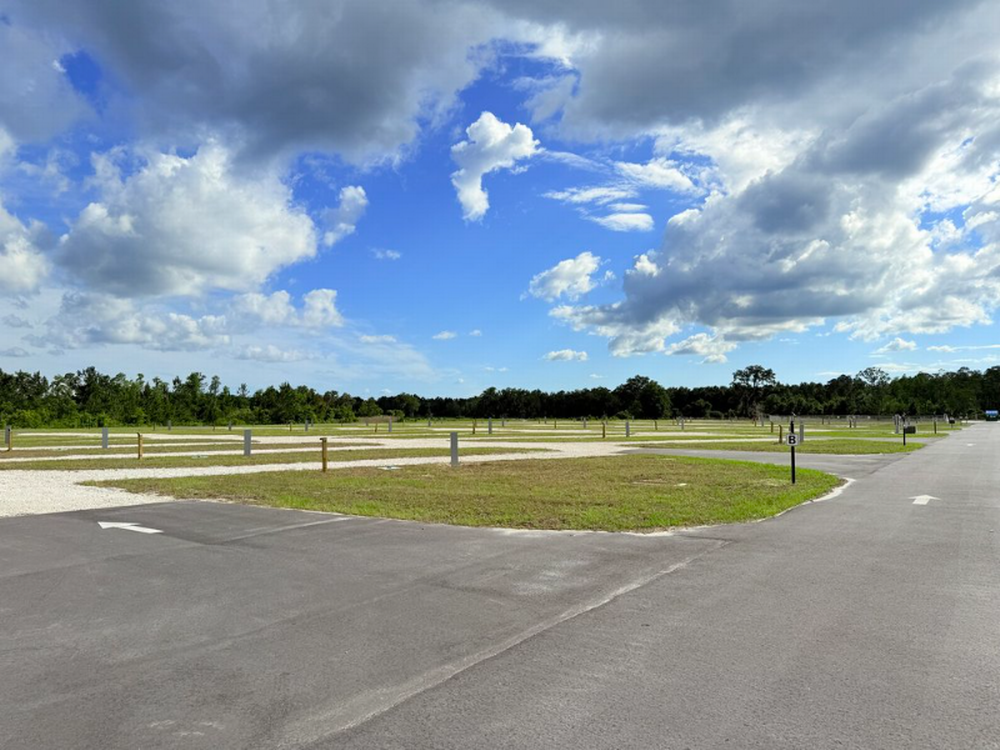 RV sites under blue skies at Sharrah's RV Park