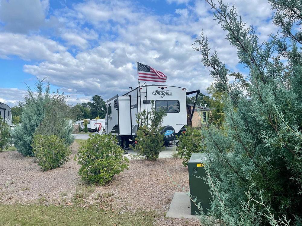 A travel trailer with an American flag