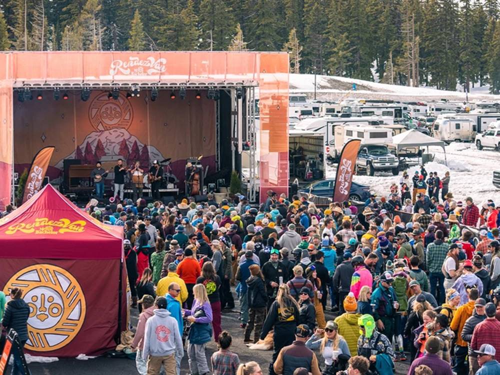 Outdoor music venue with people watching