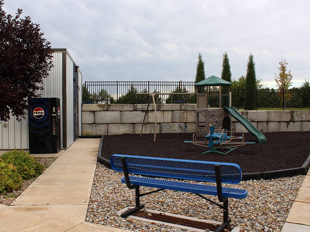A blue bench near the playground
