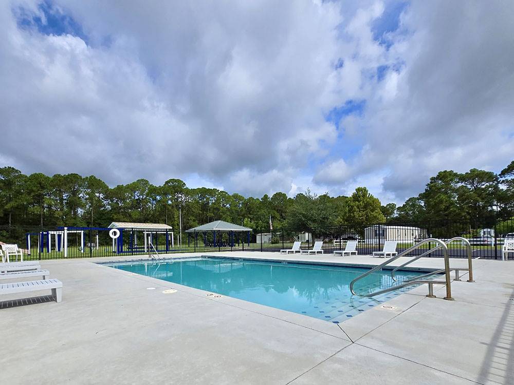Pool area with lounge chairs