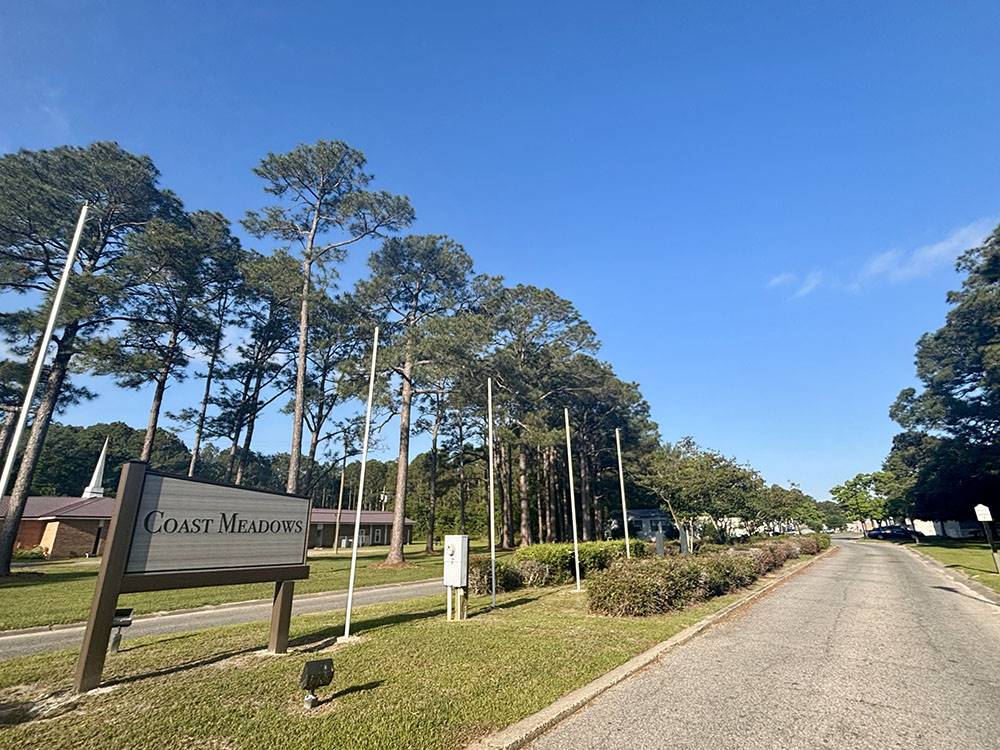 Paved road leading to park