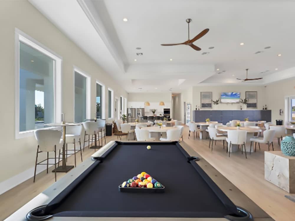 Billiards and dining tables in the rec hall