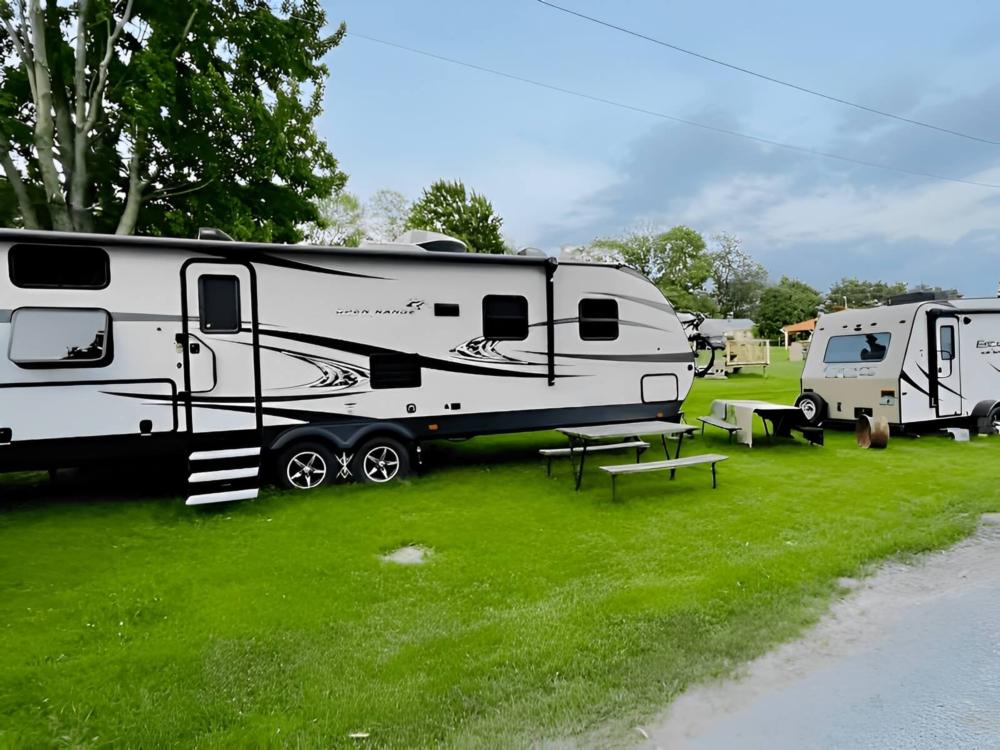 Parked trailers at site 10 Acres Campground