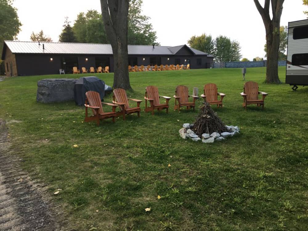 Wooden chairs by a fire pit