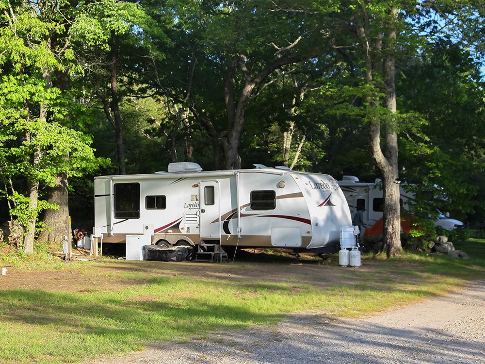 A travel trailer parked at site