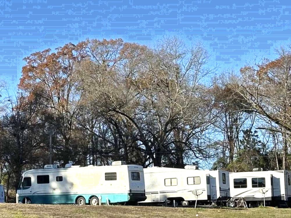 Parked RV's at site The Barn RV Park