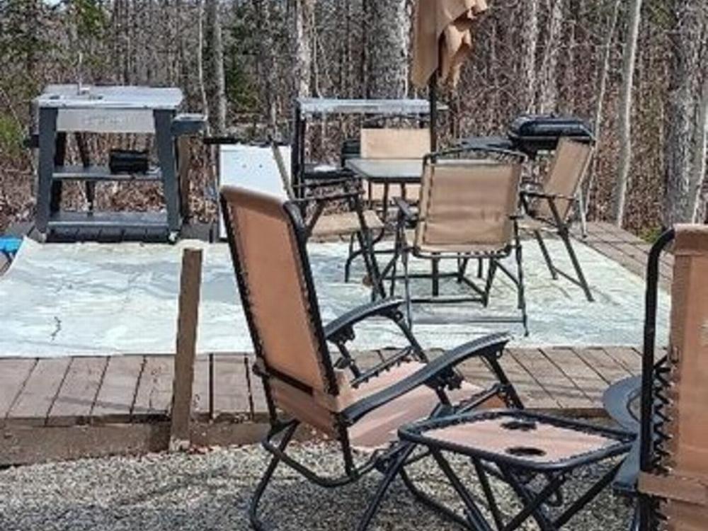 Patio with Bbq and seating area at Mystic Valley Campground