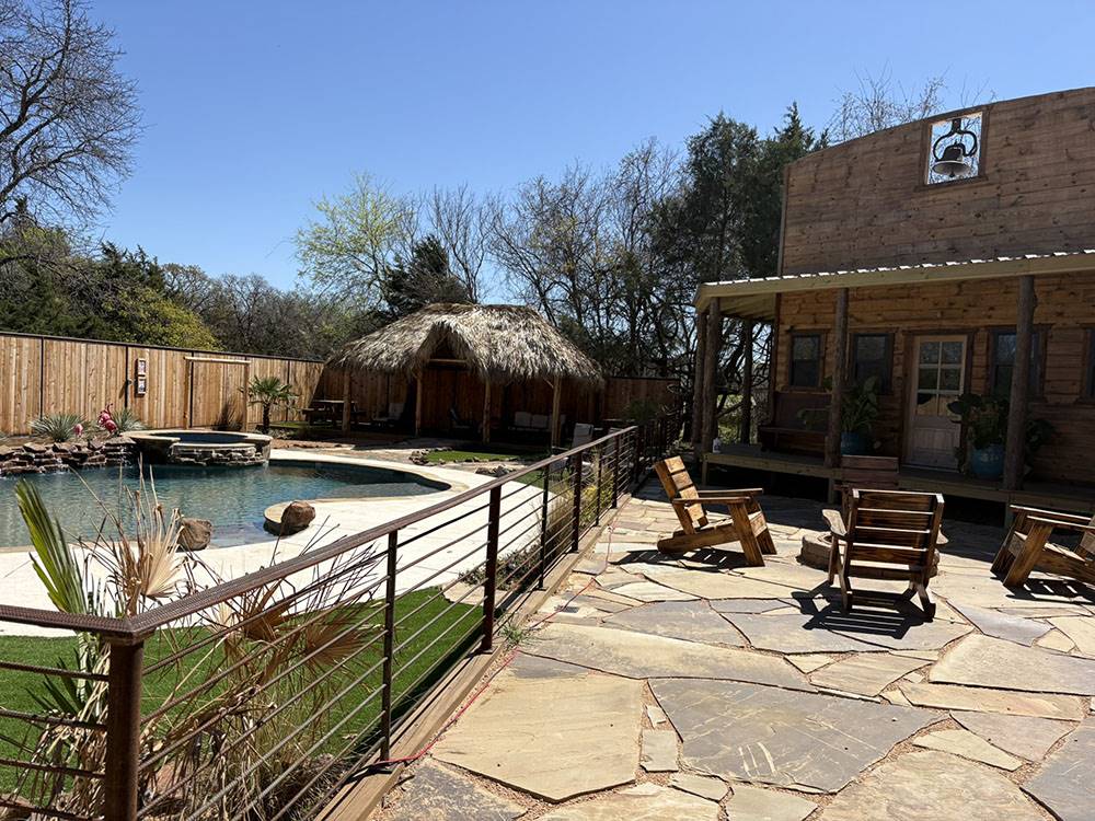 The pool and seating around a fire pit