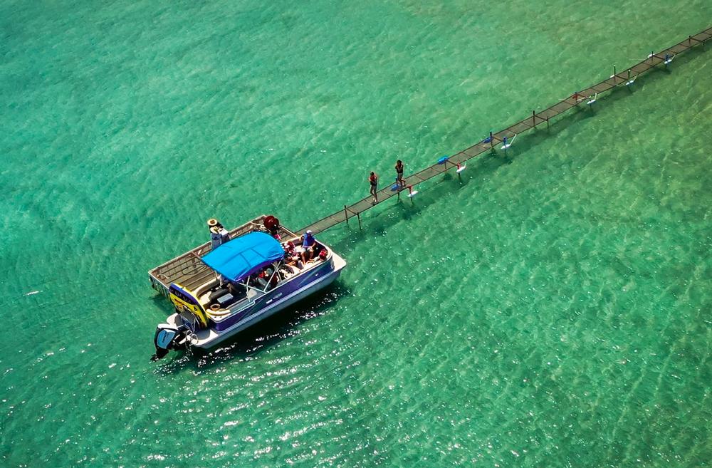 Boat parked near dock at Sun Outdoors Garden City Utah