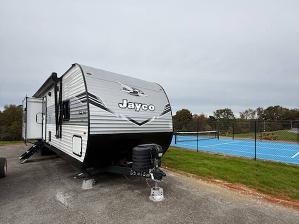 A travel trailer parked at a site