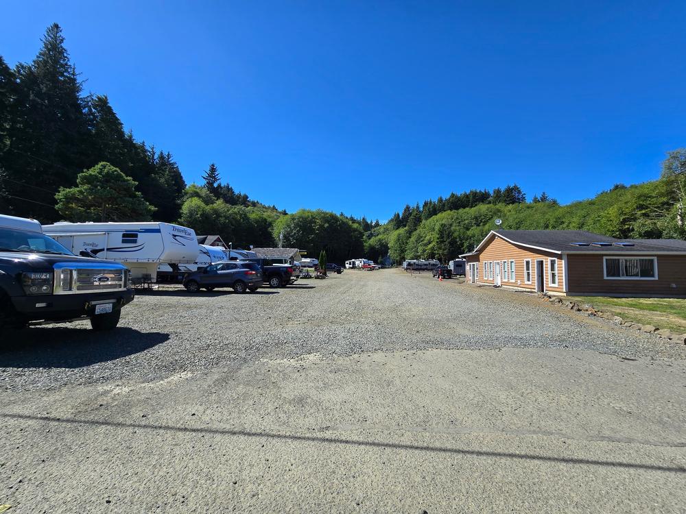 Parked trailers and vehicles at site Fisherman's Cove RV Park