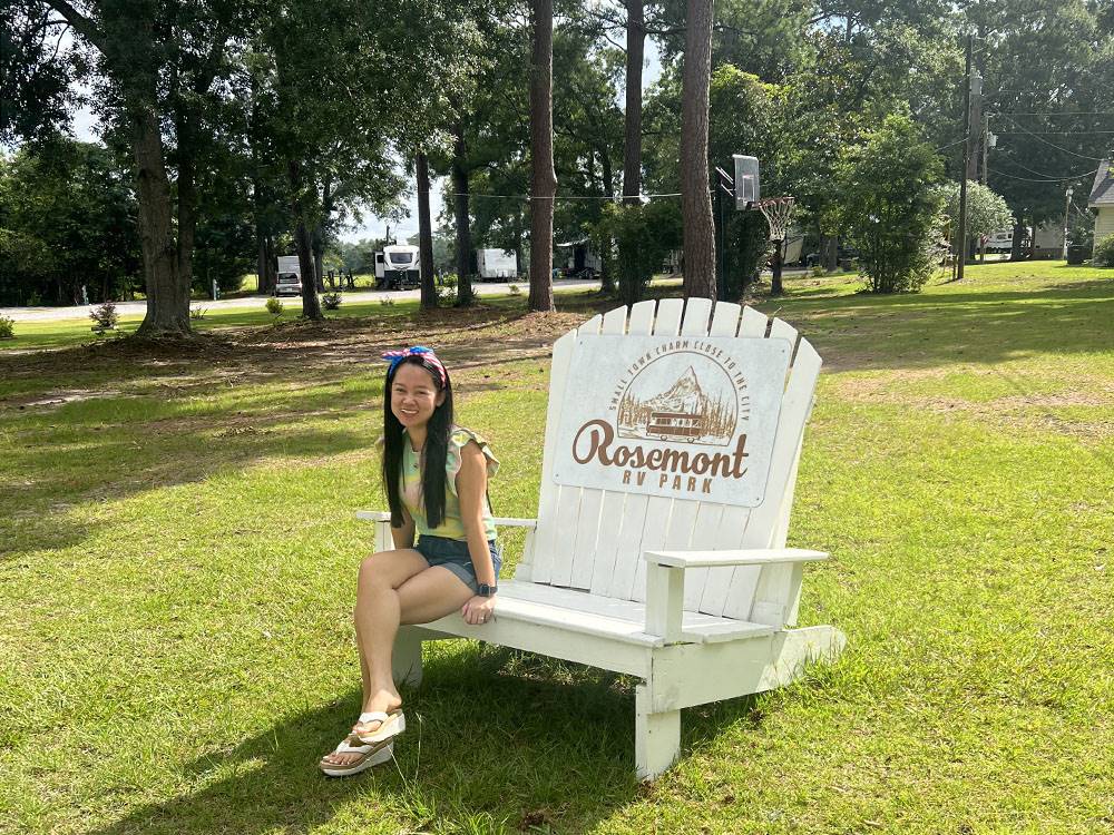 A woman poses on a chair
