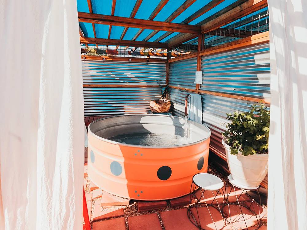 Outdoor hot tub under canopy