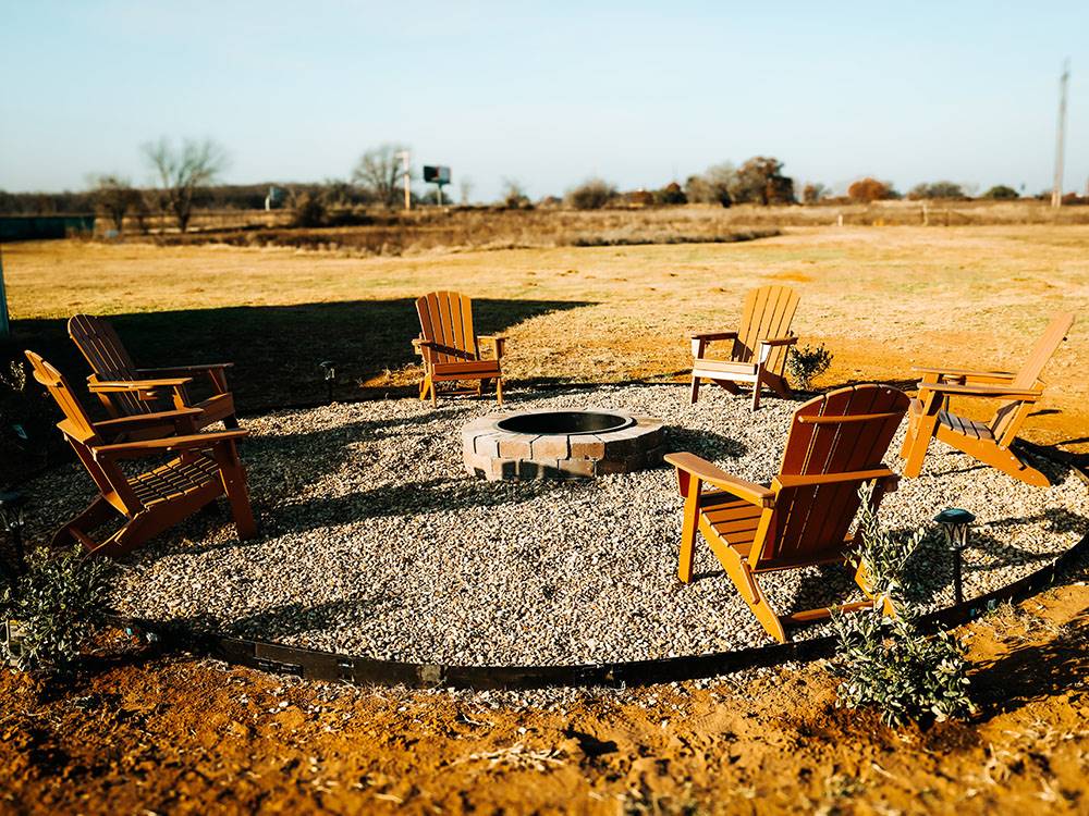 Group of chairs around a fire pit