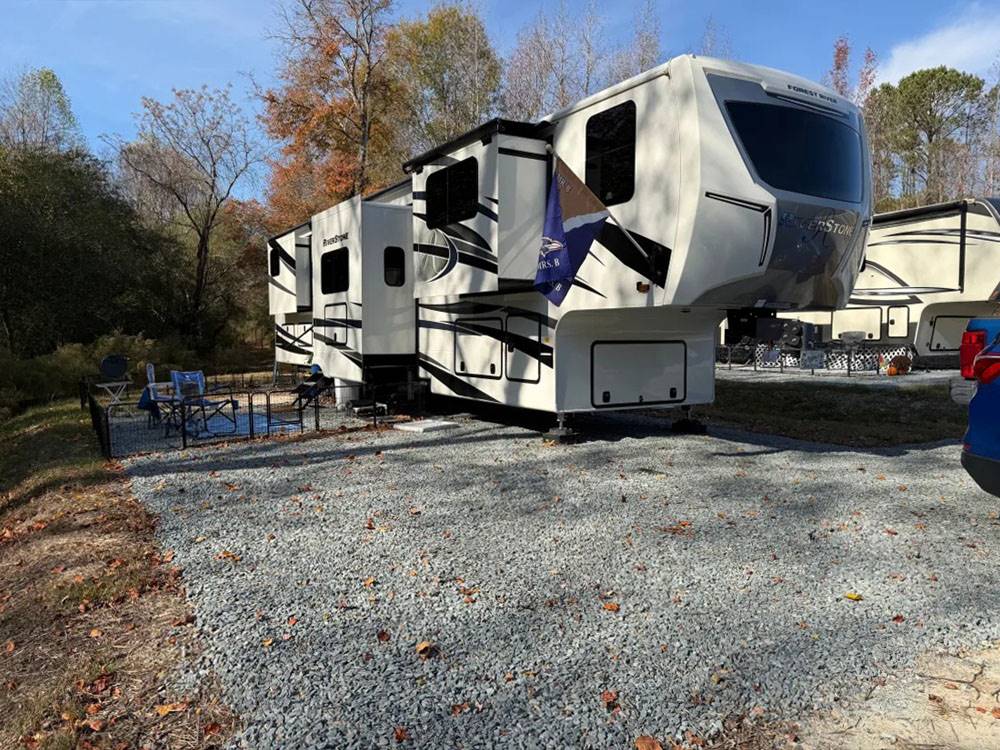 A fifth wheel with slide-outs at a site