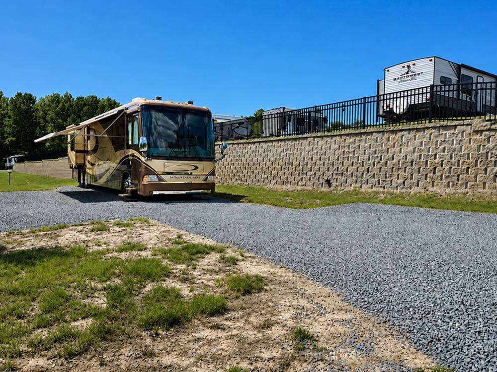 An RV with an awning at a site