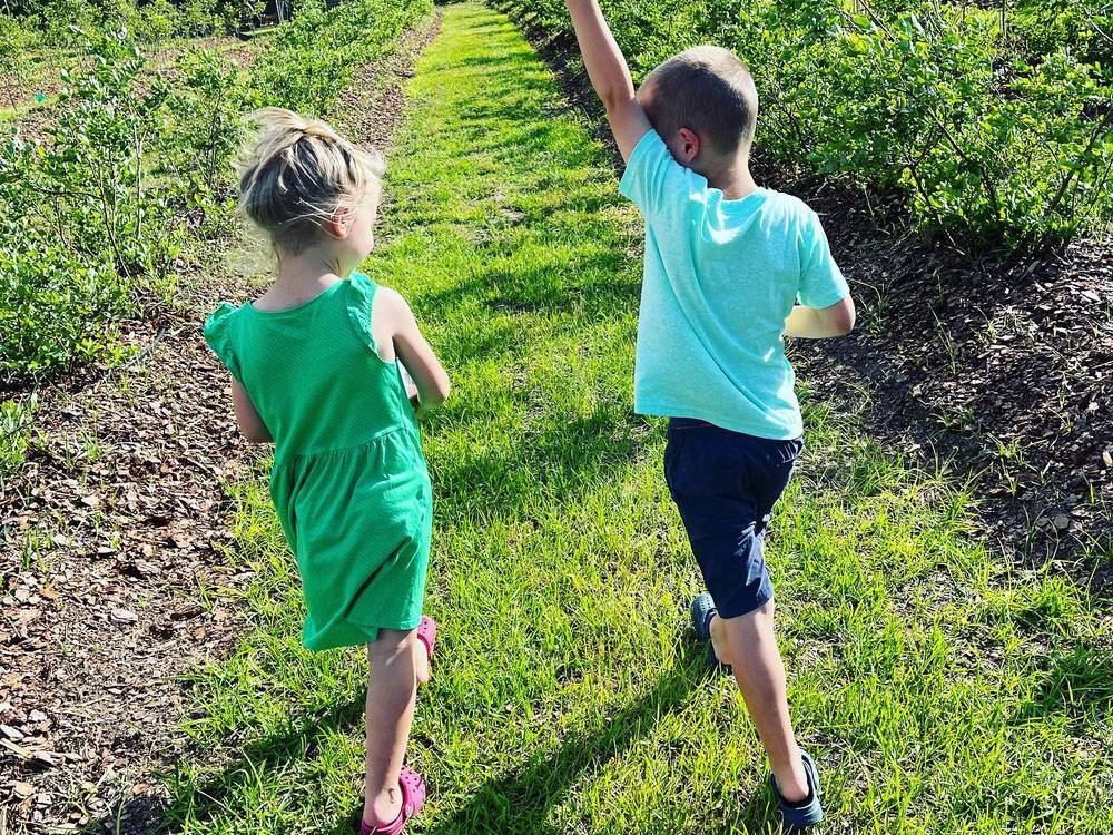 Kids walking in a field