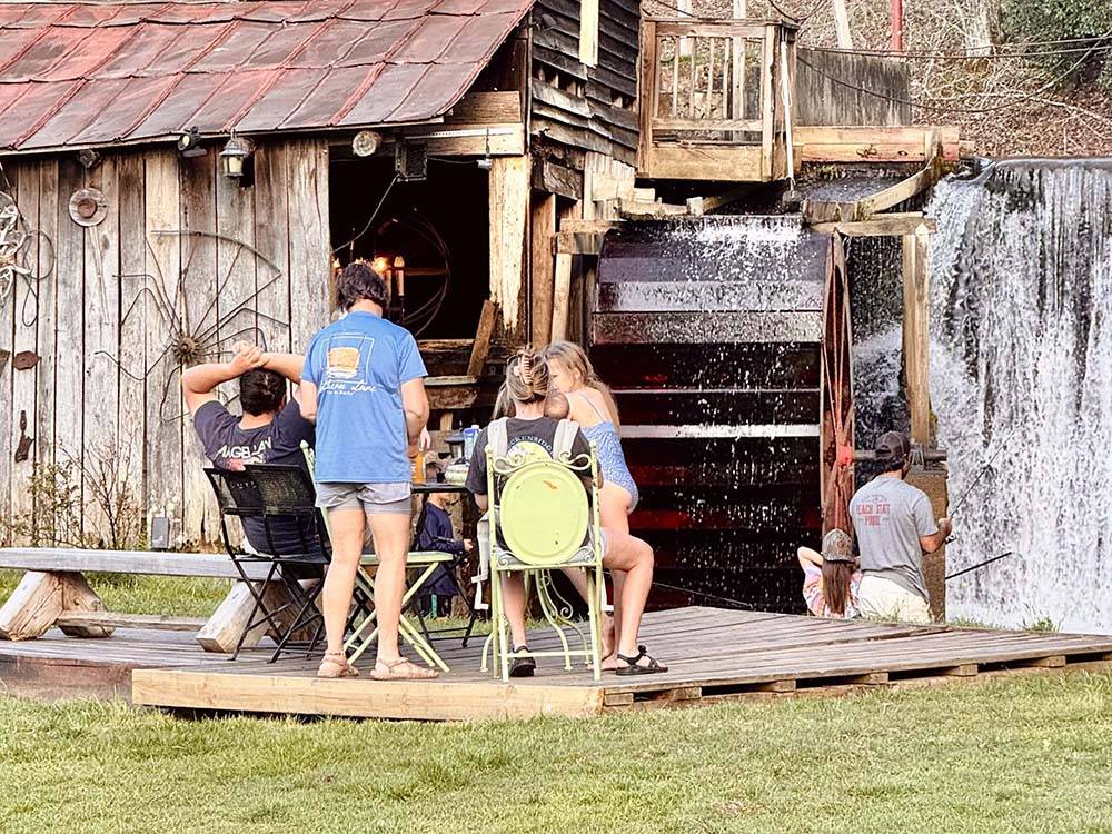 People relaxing and fishing at the Mill