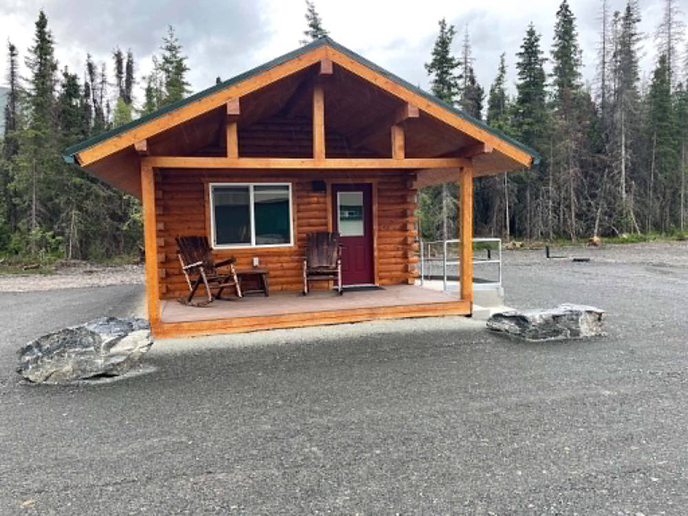 A rental cabin with a covered porch