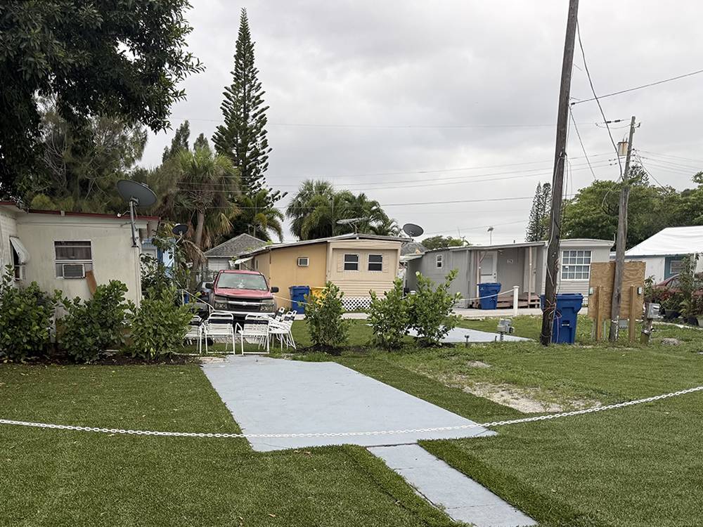 A paved RV site surrounded by grass