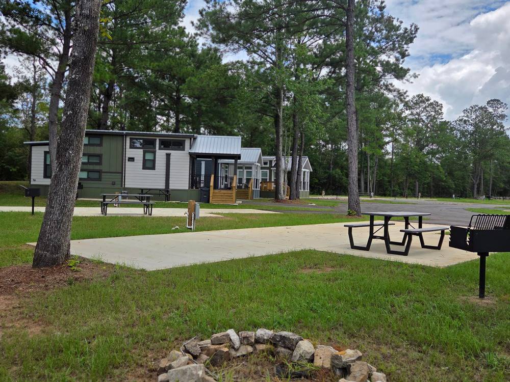 A view of rental cabins from a grassy site