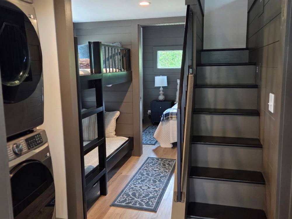 Washer and dryer, and bedrooms in a tiny home