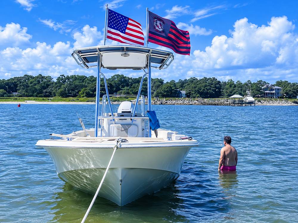 A man in the water near a boat