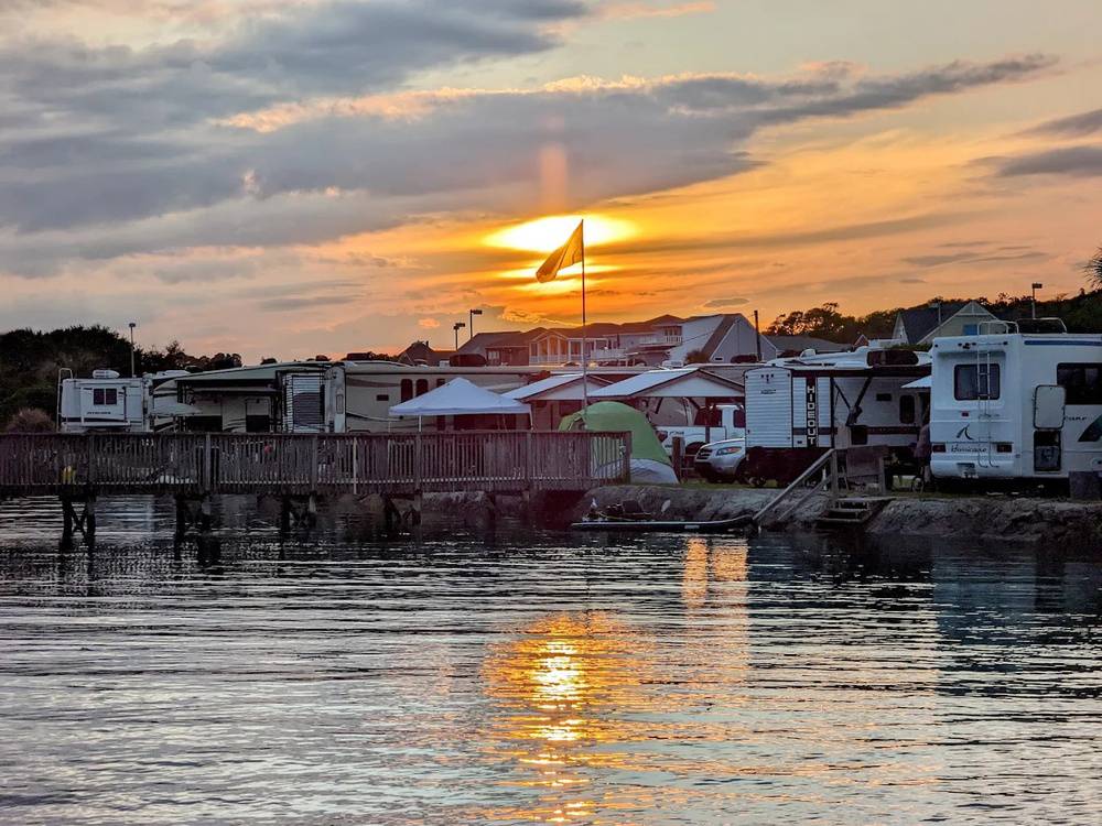 The sun sets over sites