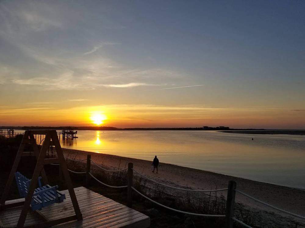 The sun sets over the water