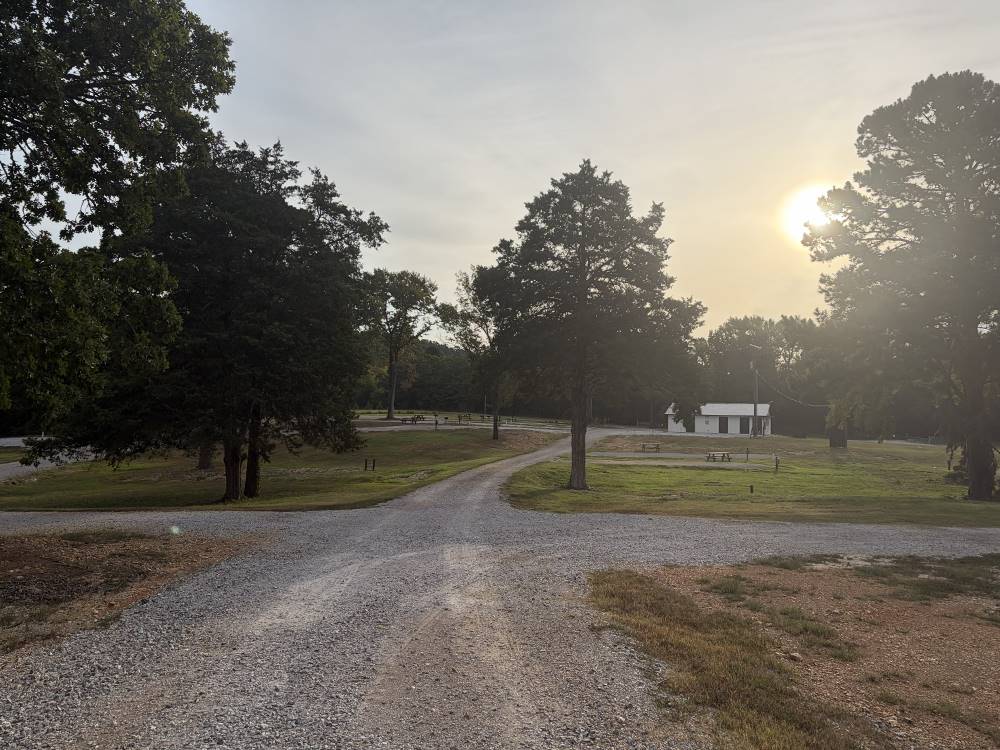 A gravel road leading to sites