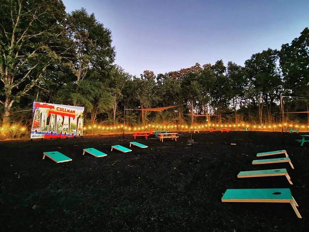 The cornhole area at dusk