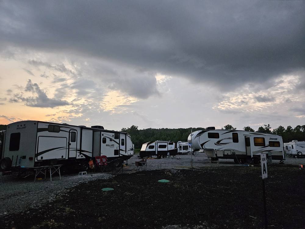 A variety of travel trailers at sites