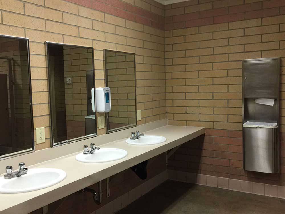 Clean bathroom with 3 sinks at HEYBURN RIVERSIDE RV PARK