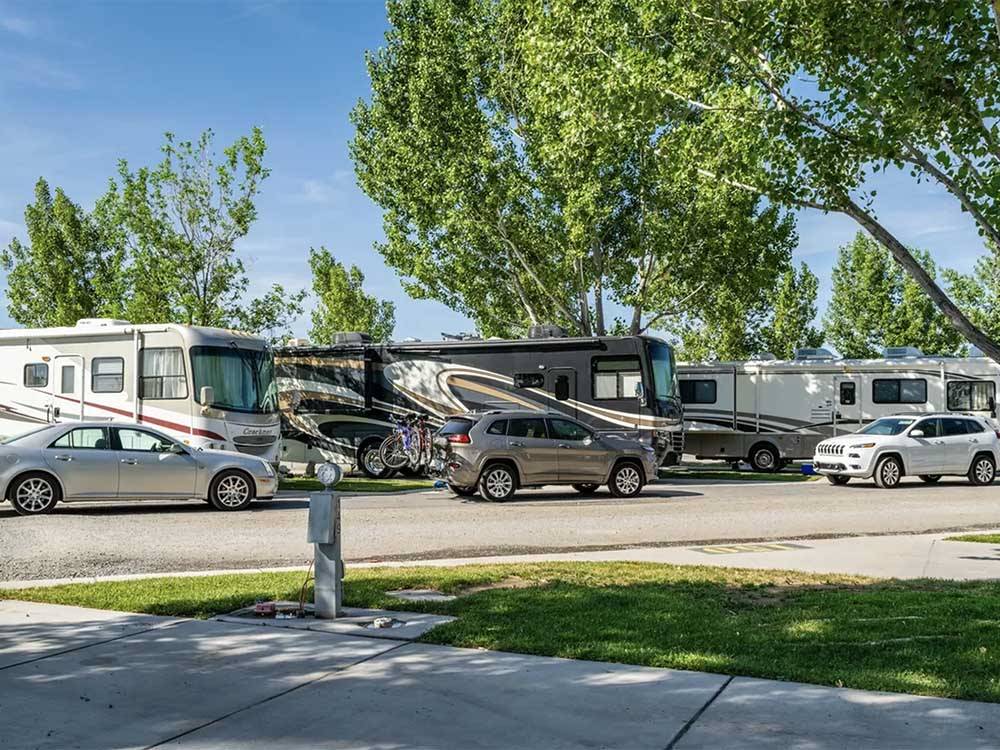 A row of motorhomes in RV sites at DESERT ROSE RV PARK