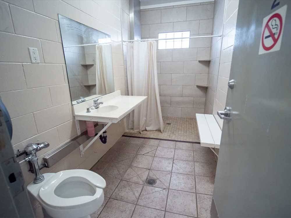 The bathroom and shower stall at DESERT ROSE RV PARK